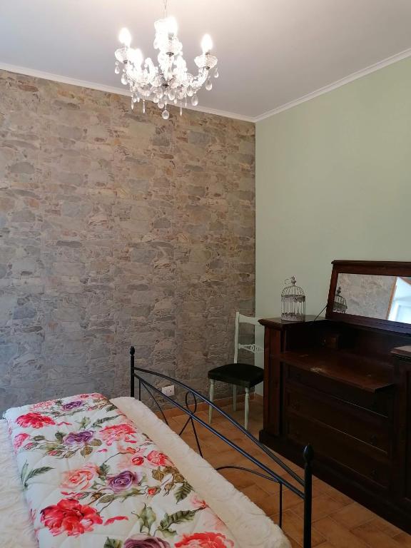 Łóżko lub łóżka w pokoju w obiekcie La Maisonette del Borgo