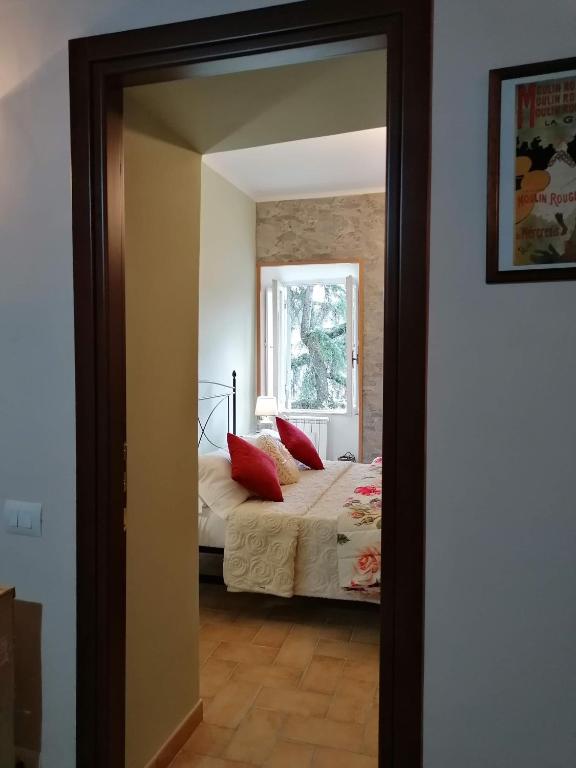 Łóżko lub łóżka w pokoju w obiekcie La Maisonette del Borgo