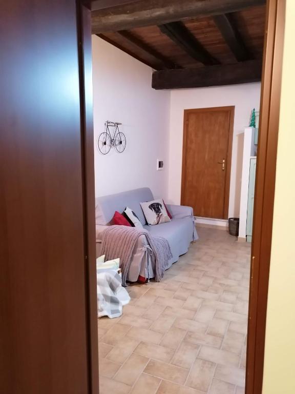 Łóżko lub łóżka w pokoju w obiekcie La Maisonette del Borgo