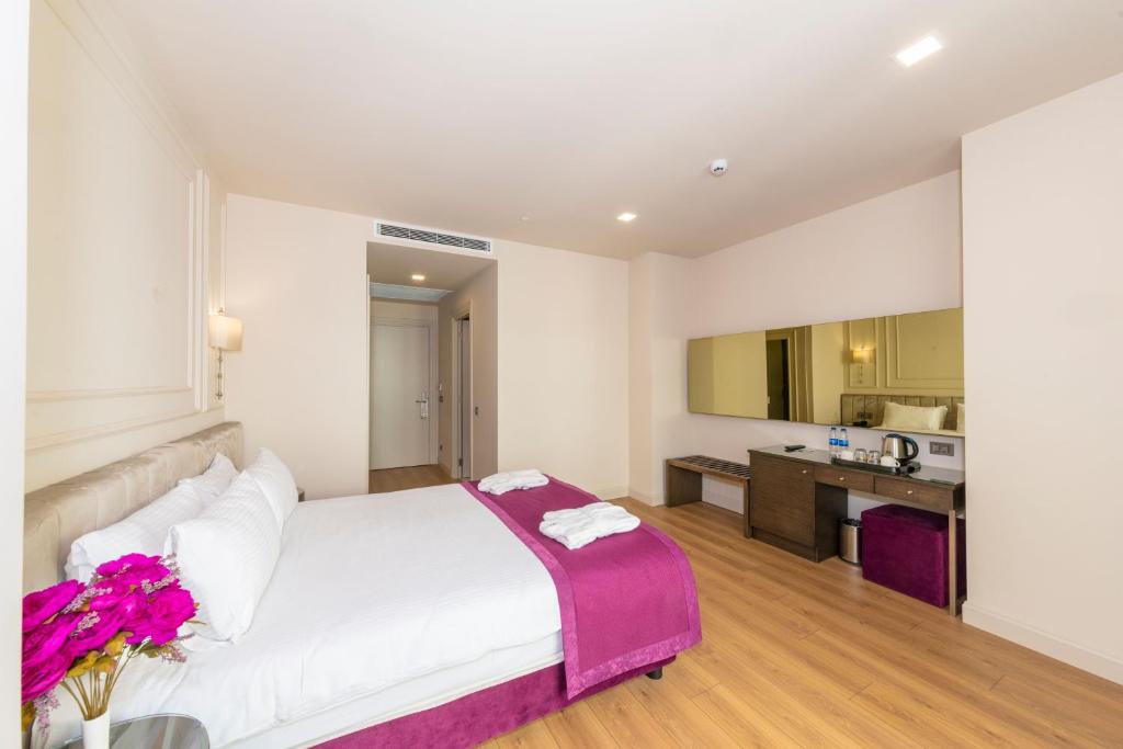A bed or beds in a room at The Hotel Beyaz Saray & Spa - Special Category