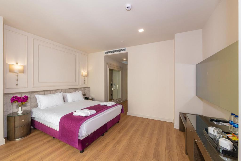 A bed or beds in a room at The Hotel Beyaz Saray & Spa - Special Category