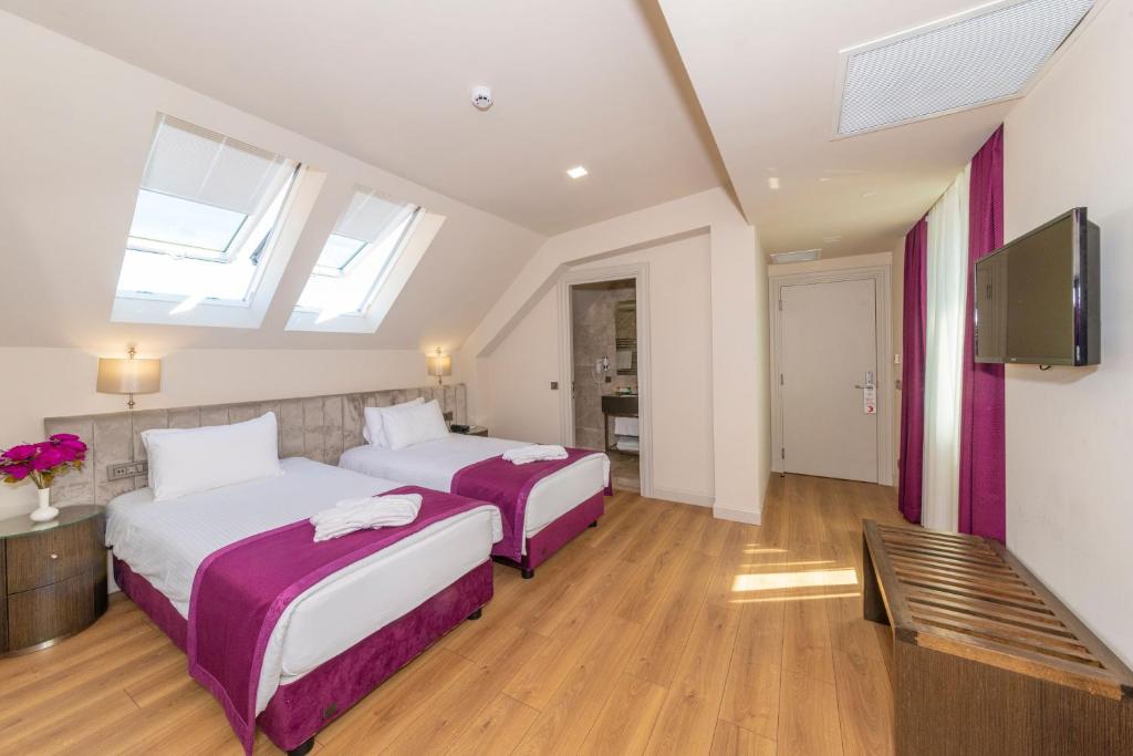 A bed or beds in a room at The Hotel Beyaz Saray & Spa - Special Category