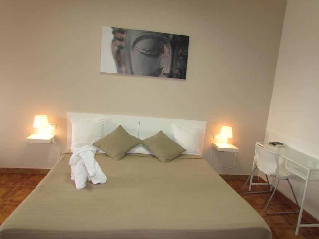 A bed or beds in a room at El Manantial