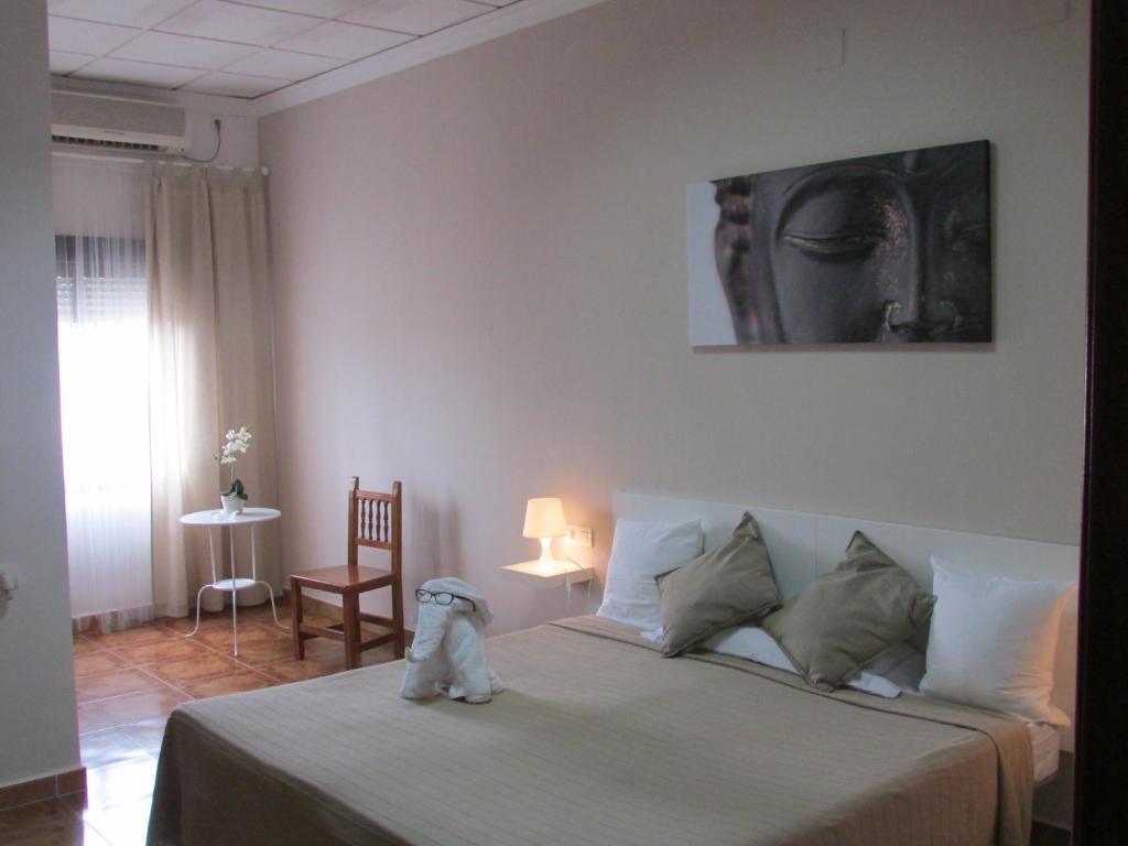A bed or beds in a room at El Manantial
