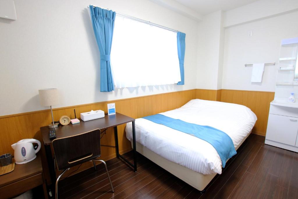 Postel nebo postele na pokoji v ubytování Phoenix Ryukyu Henzanbaru -SEVEN Hotels and Resorts-