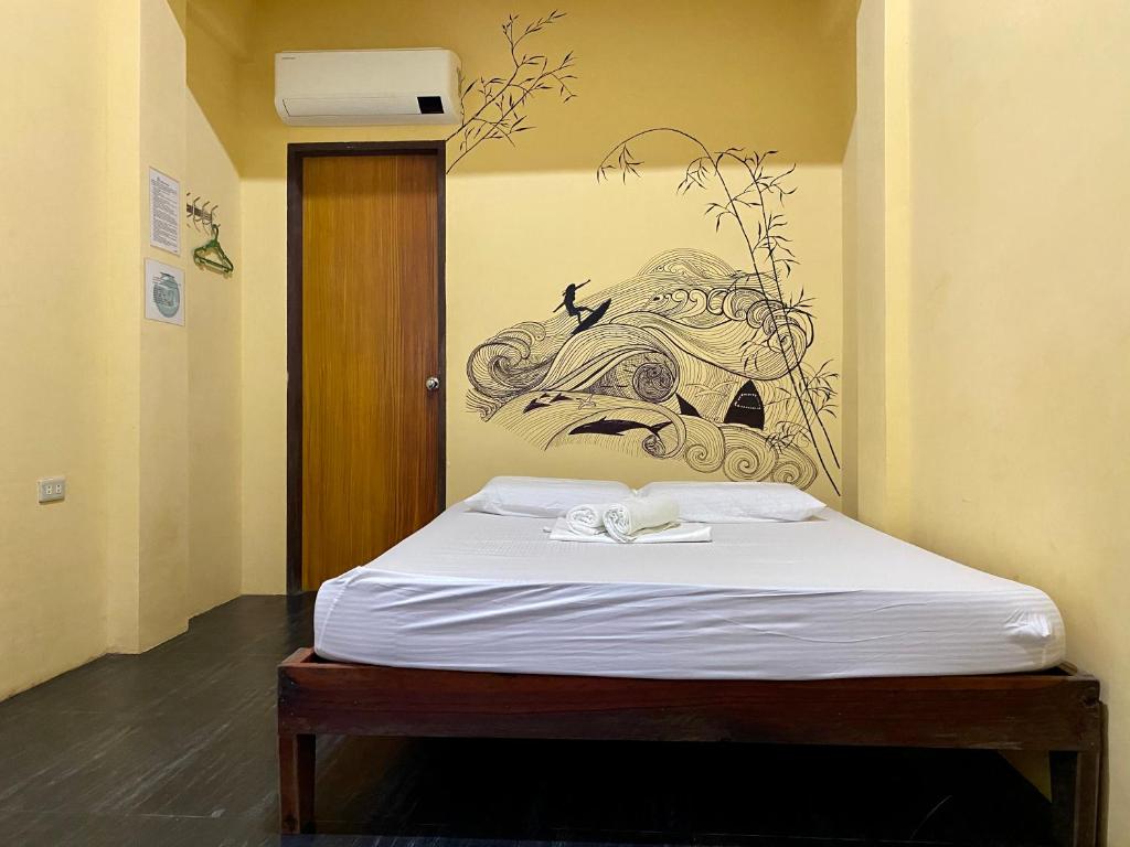 Postel nebo postele na pokoji v ubytování Ilakai Hostel