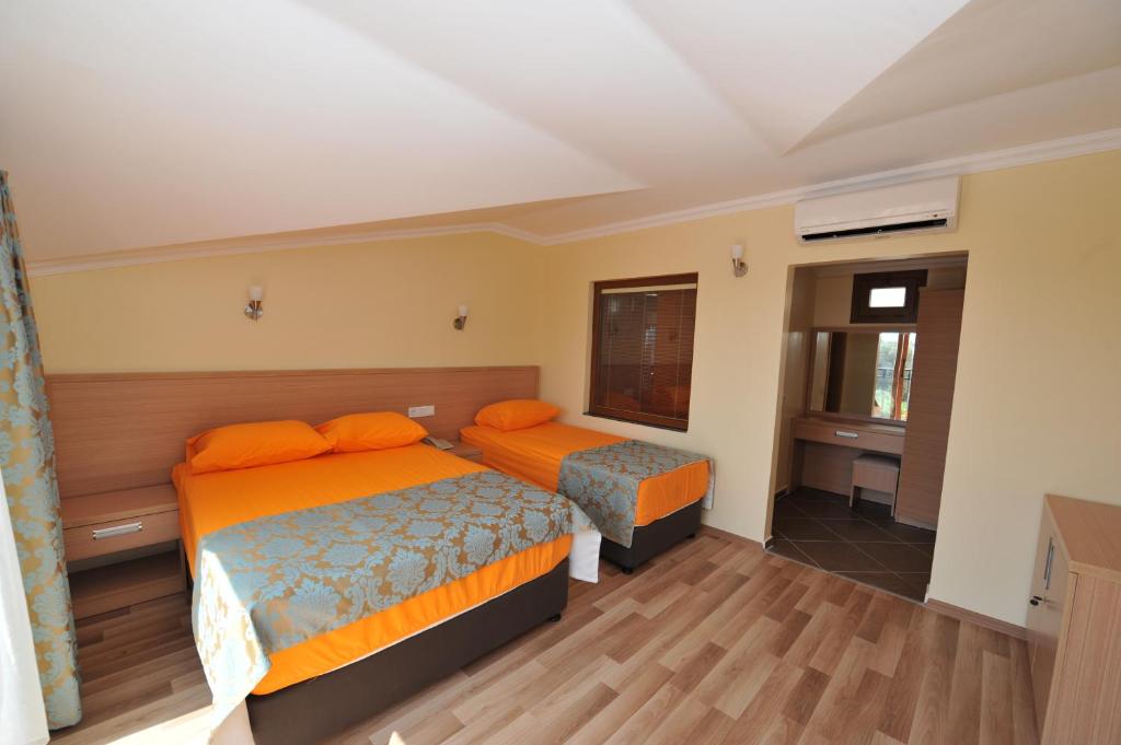 Postel nebo postele na pokoji v ubytování Magic Tulip Beach Hotel