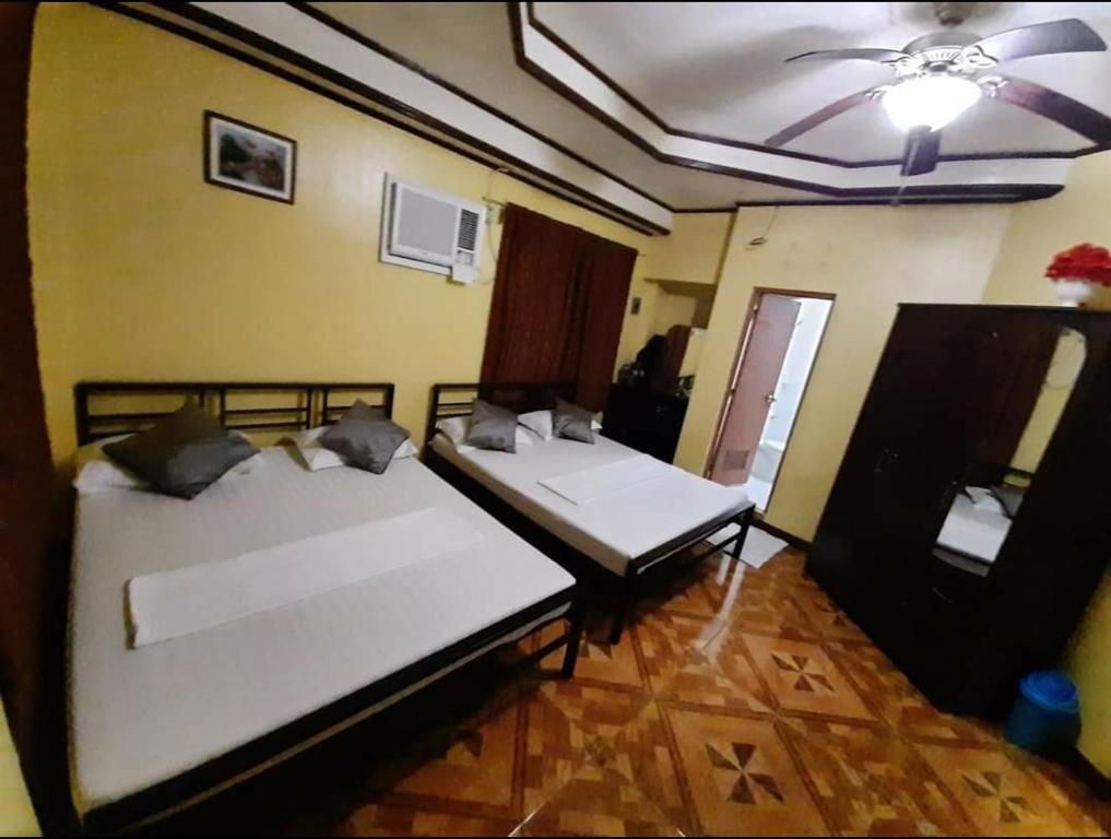 Postel nebo postele na pokoji v ubytování Carribean Transient House
