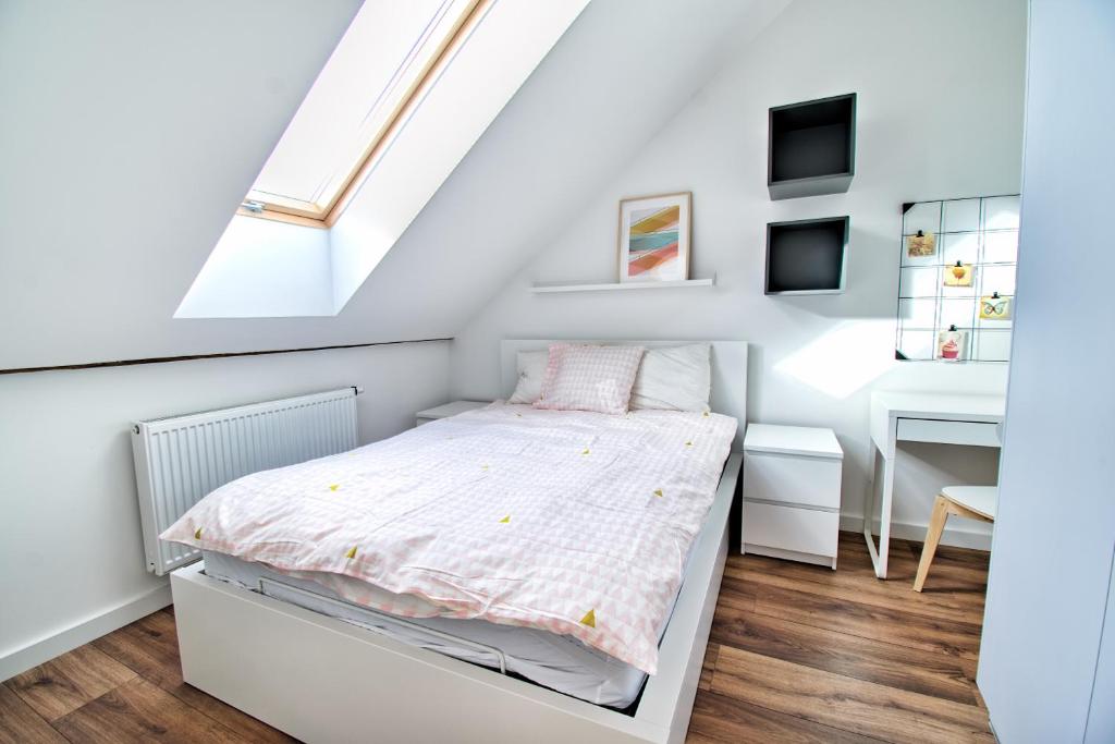 Posteľ alebo postele v izbe v ubytovaní City Life Apartments Kraków