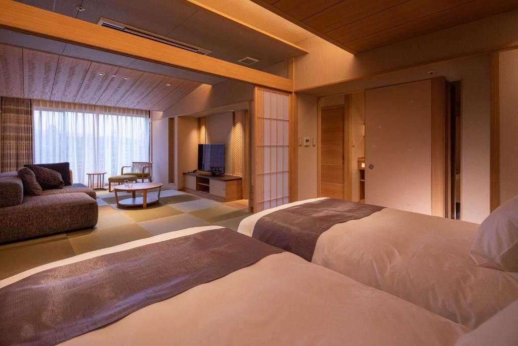 Postel nebo postele na pokoji v ubytování Hotel Wakamizu