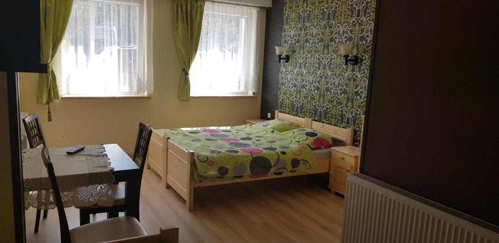 Posteľ alebo postele v izbe v ubytovaní Gosciniec Pod Brzegiem