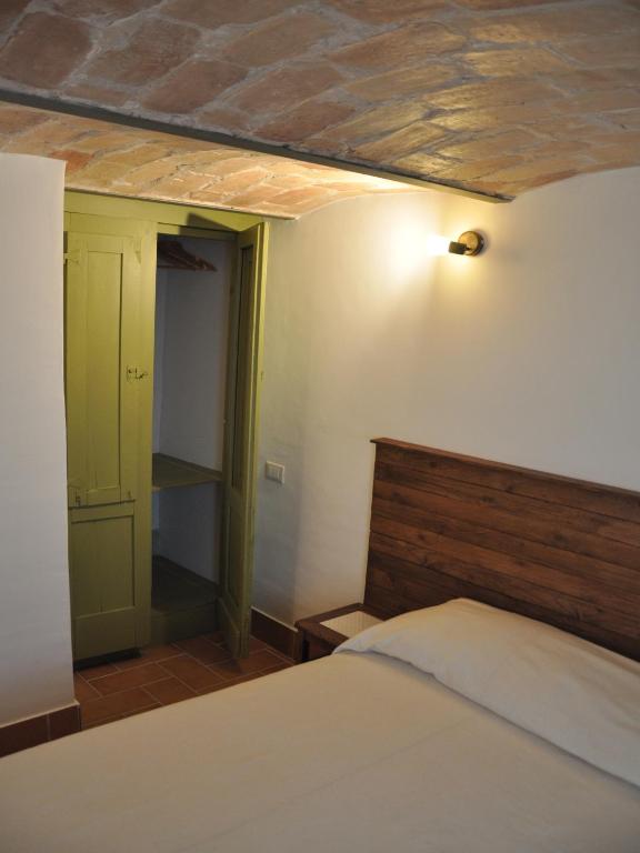Postel nebo postele na pokoji v ubytování Casa Dona' Penne