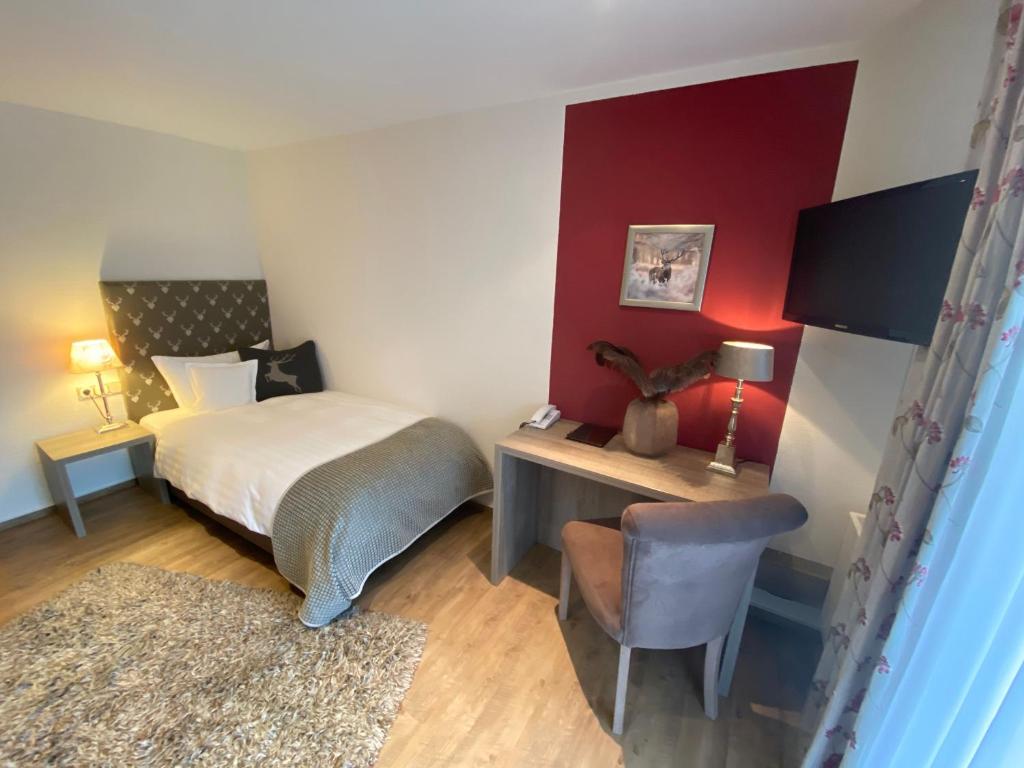 Postel nebo postele na pokoji v ubytování Hotel Hennemann