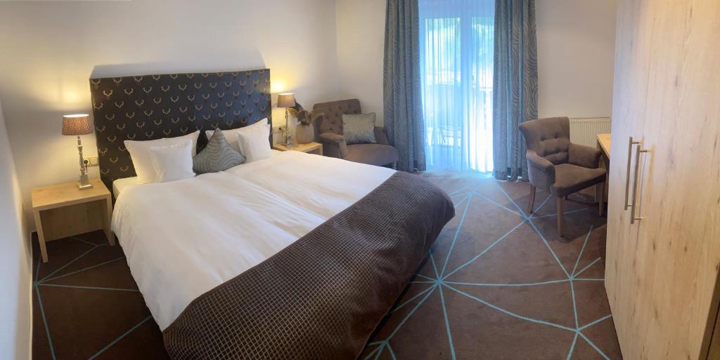 Postel nebo postele na pokoji v ubytování Hotel Hennemann