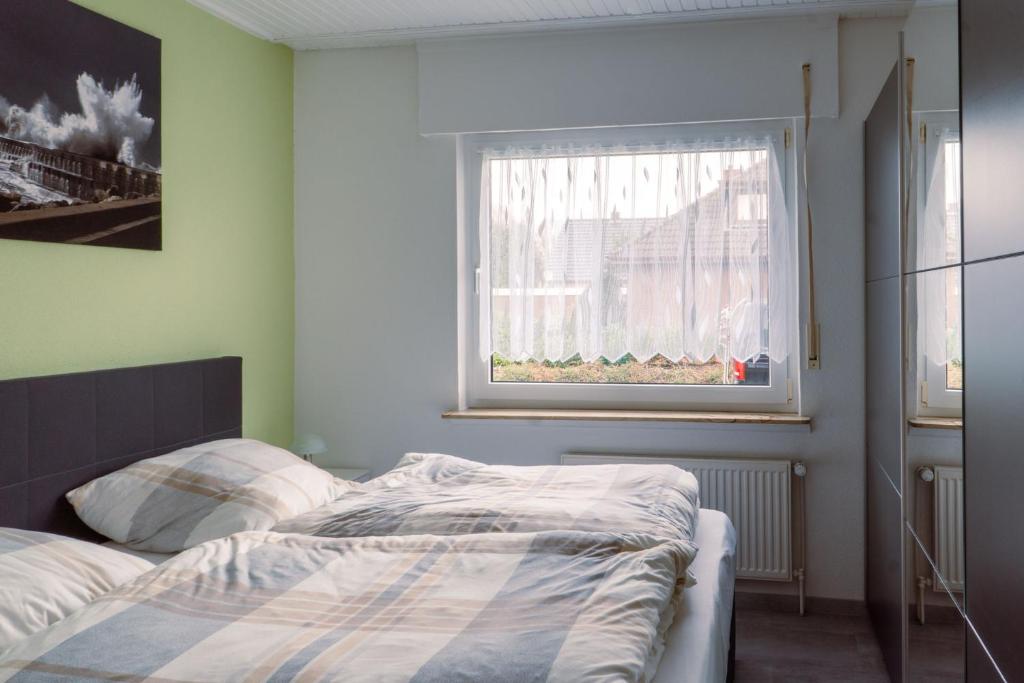 Postel nebo postele na pokoji v ubytování Ferienhaus Martens