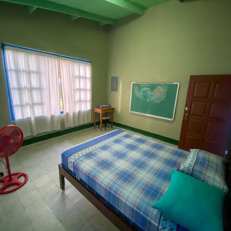 Postel nebo postele na pokoji v ubytování Hostal Juan Lindo