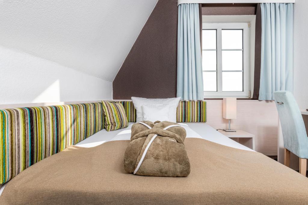 Postel nebo postele na pokoji v ubytování Hotel und Spa Lundenbergsand