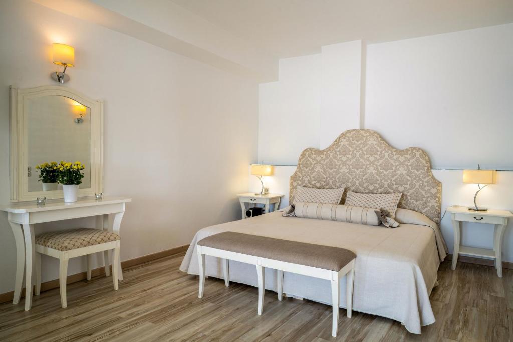 Postel nebo postele na pokoji v ubytování Delfini Villas