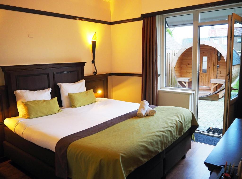 Postel nebo postele na pokoji v ubytování Boutique Hotel, Restaurant & Wellness Westerburcht