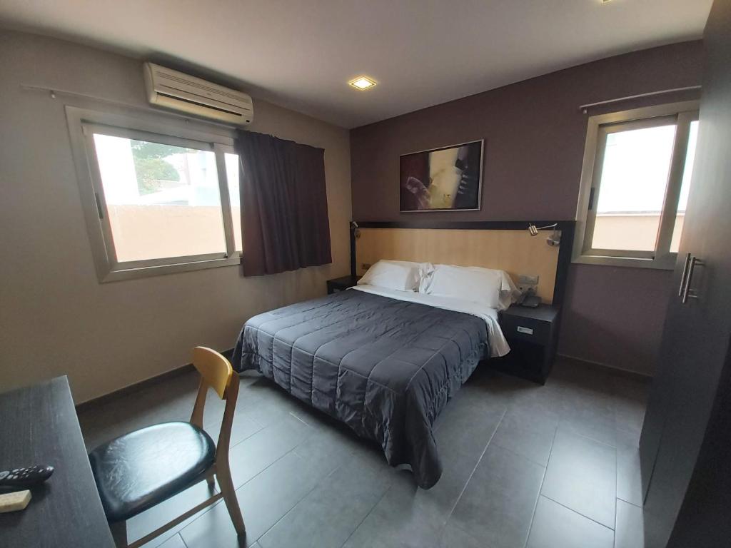 Postel nebo postele na pokoji v ubytování Hotel 170