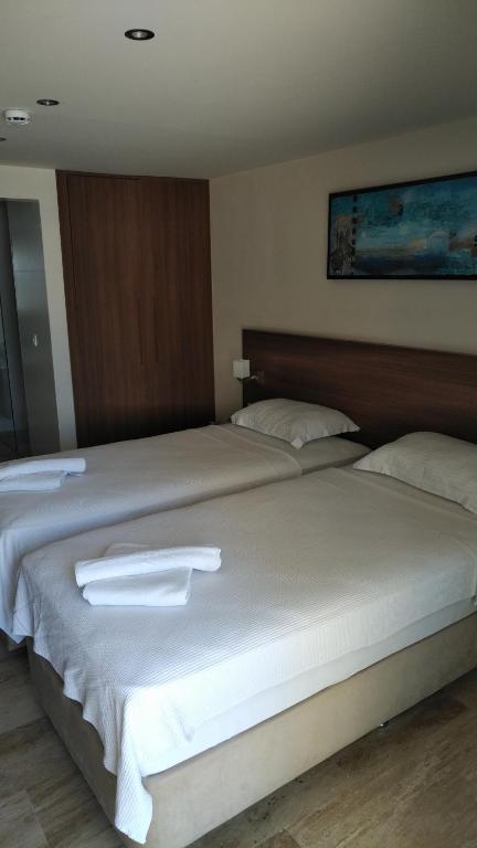Postel nebo postele na pokoji v ubytování Neopol Hotel