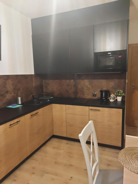 Kuchyňa alebo kuchynka v ubytovaní Apartamenty Butorowy