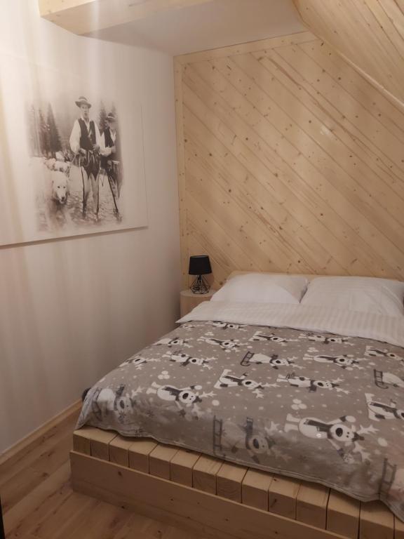 Posteľ alebo postele v izbe v ubytovaní Apartamenty Butorowy