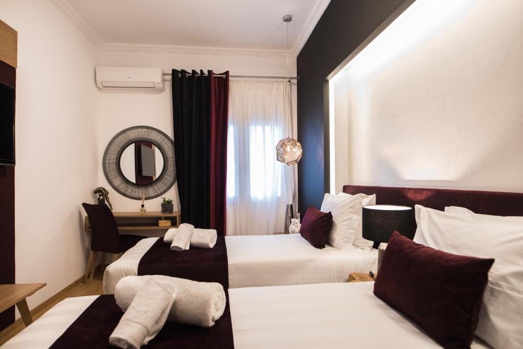 Posteľ alebo postele v izbe v ubytovaní Acropolis View Deluxe Penthouse & Luxury Apartments