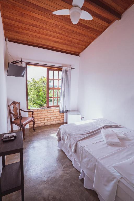 Cama ou camas em um quarto em Pousada Alto do Cajueiro