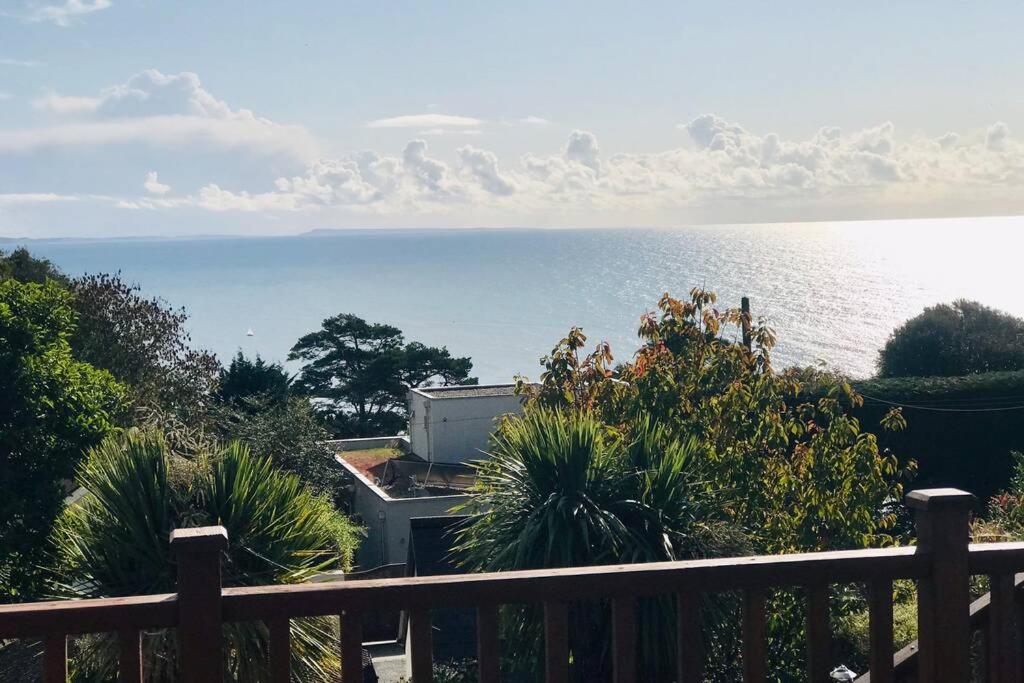 a view of the ocean from a balcony at Great couples accommodation with beautiful sea view in Lyme Regis