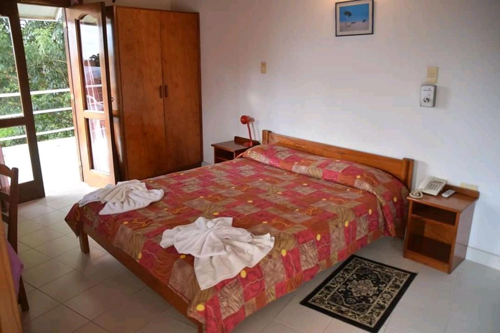 Postel nebo postele na pokoji v ubytování Hotel Palmas del Sol