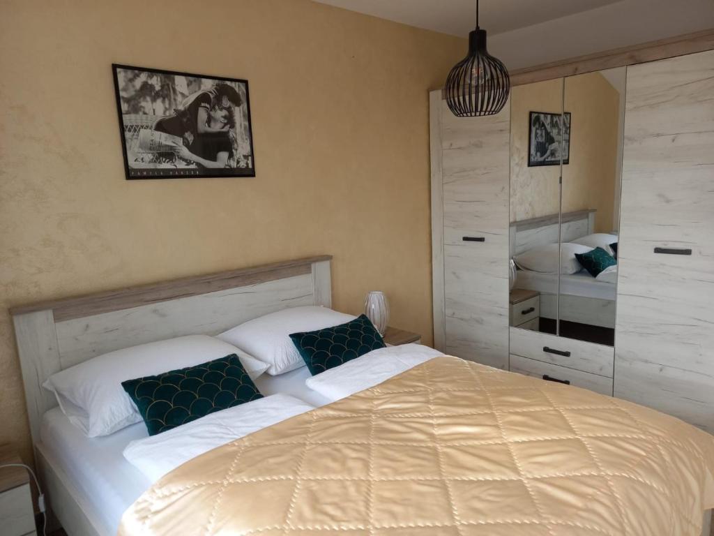Postel nebo postele na pokoji v ubytování Apartments Aurora