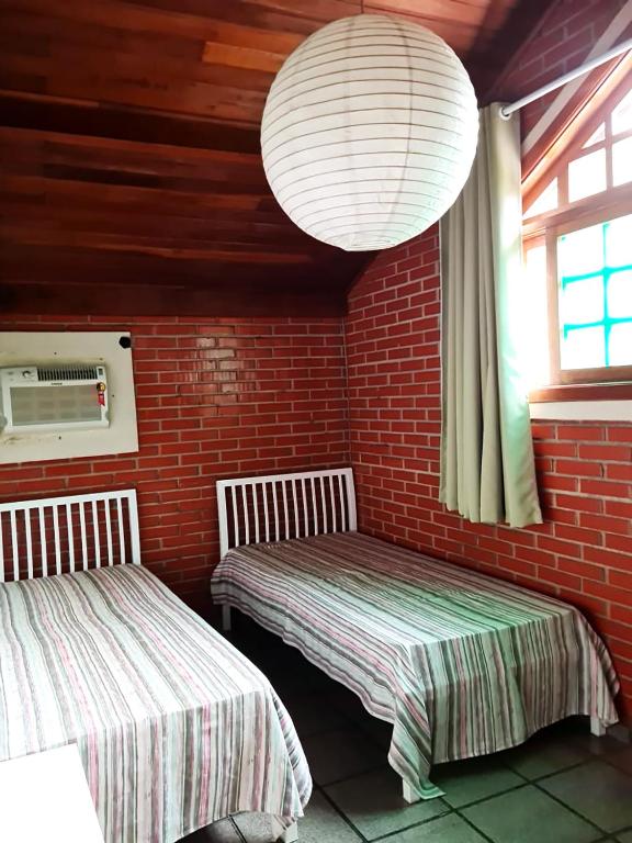  Casa perto da areia em Guaeca com WiFi e churrasq