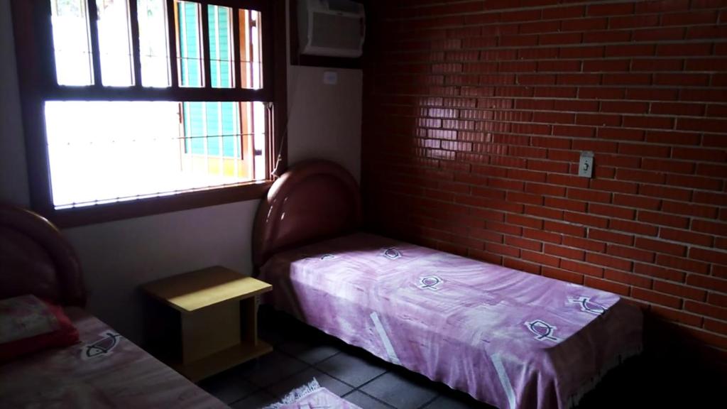  Casa perto da areia em Guaeca com WiFi e churrasq