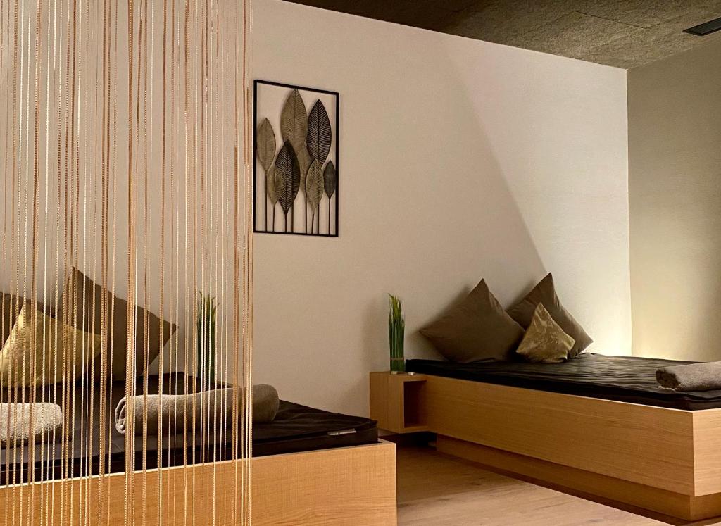 Postel nebo postele na pokoji v ubytování Garni Hotel Mezdi