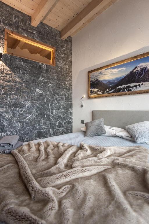 Postel nebo postele na pokoji v ubytování Casa de Fiemme