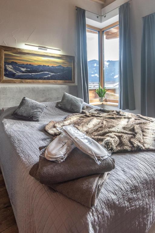Postel nebo postele na pokoji v ubytování Casa de Fiemme