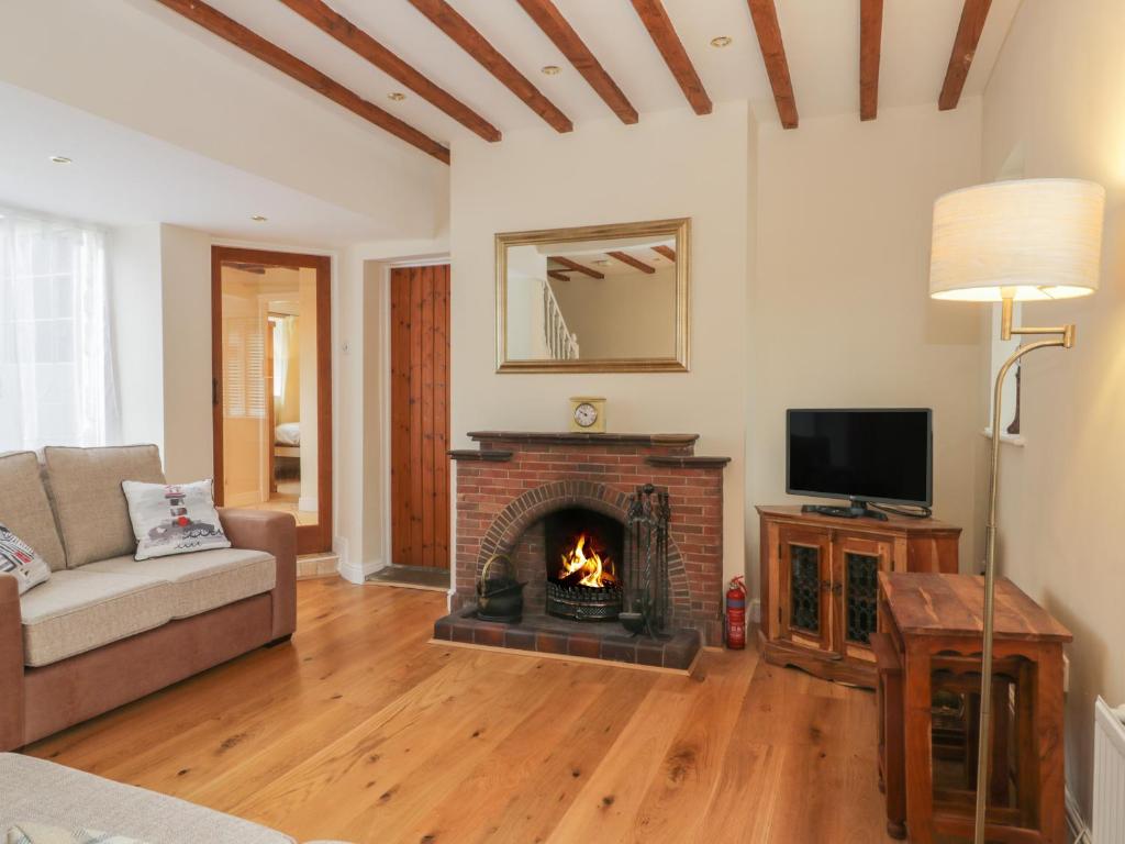 TV a/nebo společenská místnost v ubytování Wyke Lodge Cottage