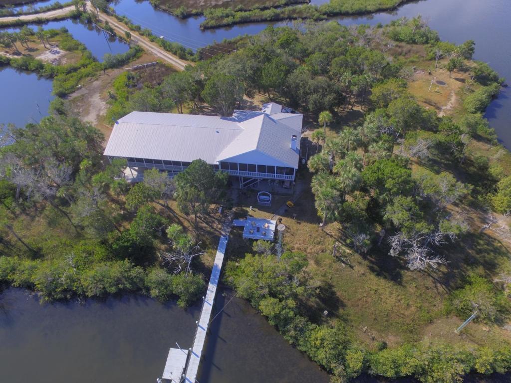 an aerial view of a house on an island in the water at Crystal River Lullaby B&B in Crystal River
