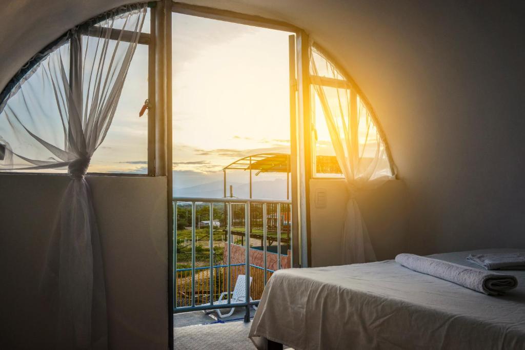 Postel nebo postele na pokoji v ubytování Tubo Hotel La Tatacoa