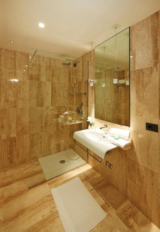 a bathroom with a sink and a shower at Cala Cuncheddi - VRetreats in Murta Maria