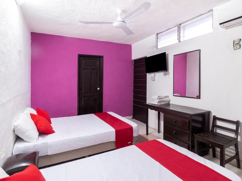 Postel nebo postele na pokoji v ubytování Hotel Aventura