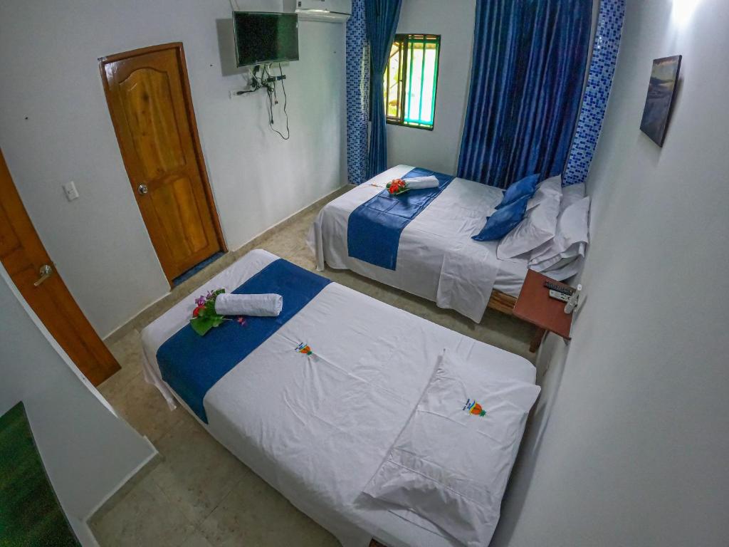 Una cama o camas en una habitación de Hotel Arena Azul