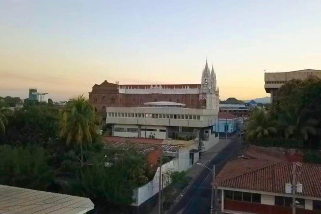 arial view of a city with a church and buildings at Casa Central completa in Santa Ana