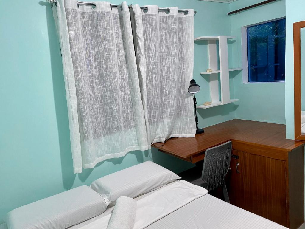 Postel nebo postele na pokoji v ubytování Ilakai Hostel