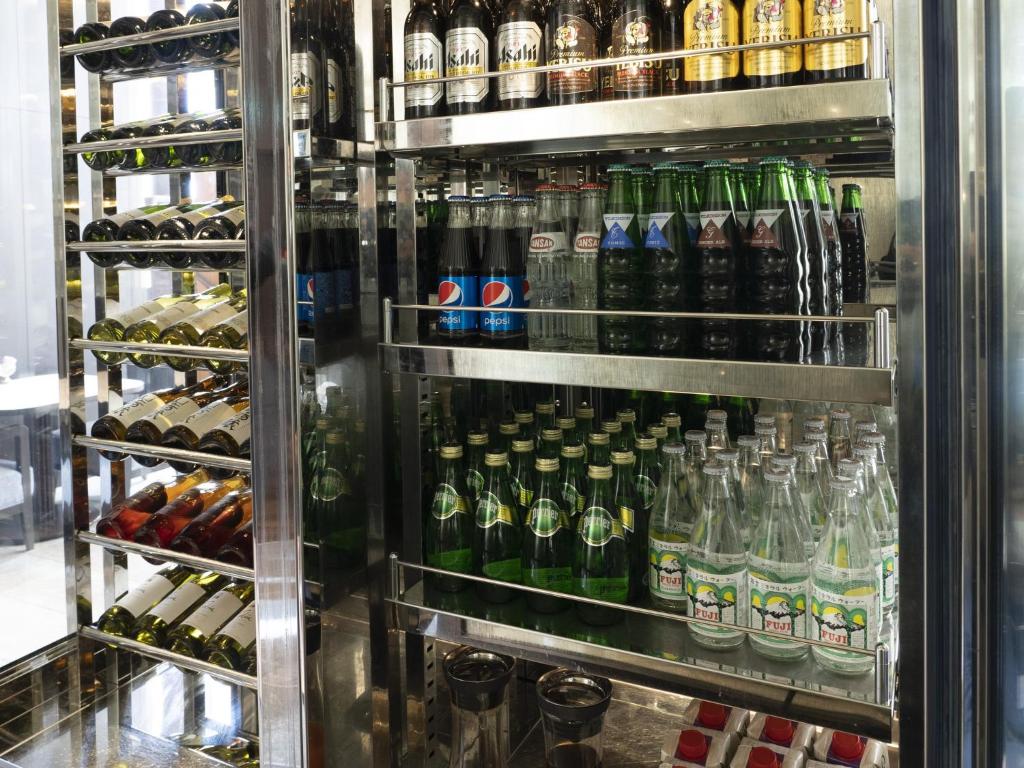 a refrigerator filled with lots of bottles of beer at Nagoya Marriott Associa Hotel in Nagoya
