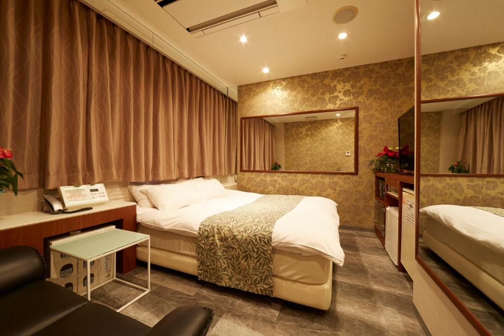 Postel nebo postele na pokoji v ubytování HOTEL Kslit Adult Only