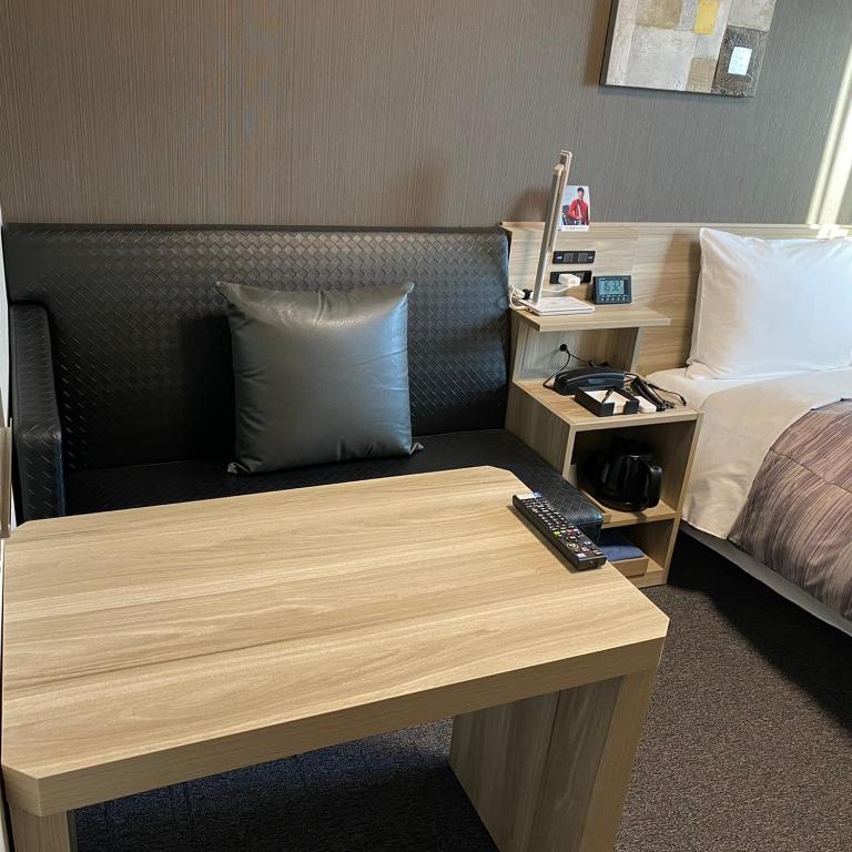 Postel nebo postele na pokoji v ubytování Route Inn Grantia Tokai Spa&Relaxation