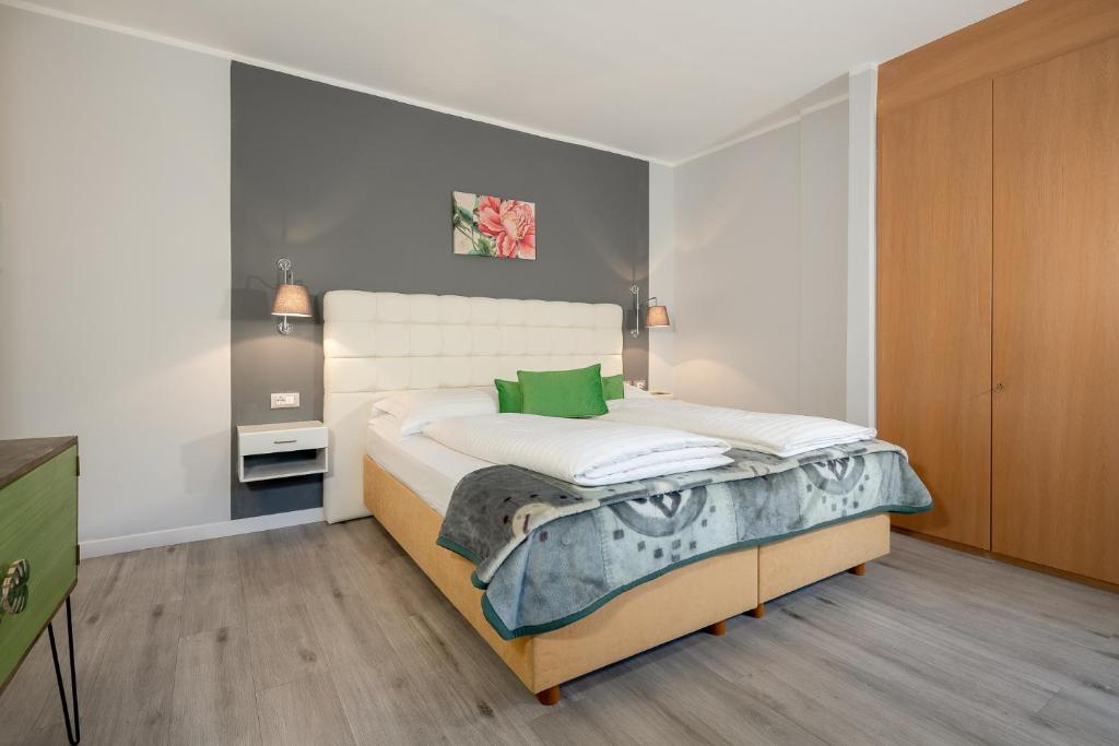 Postel nebo postele na pokoji v ubytování Hotel Aster