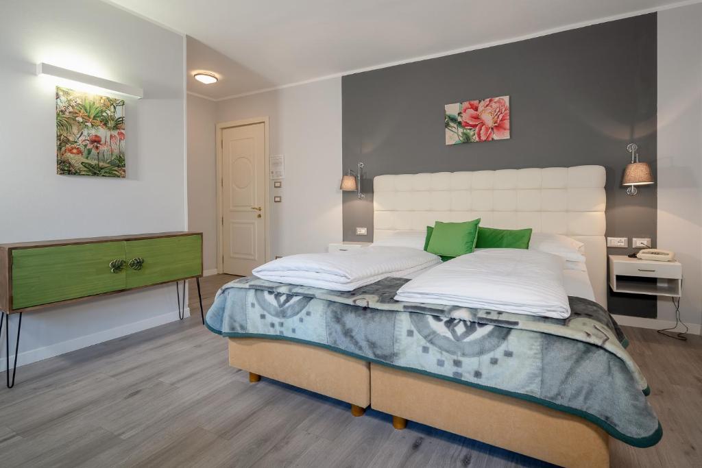 Postel nebo postele na pokoji v ubytování Hotel Aster